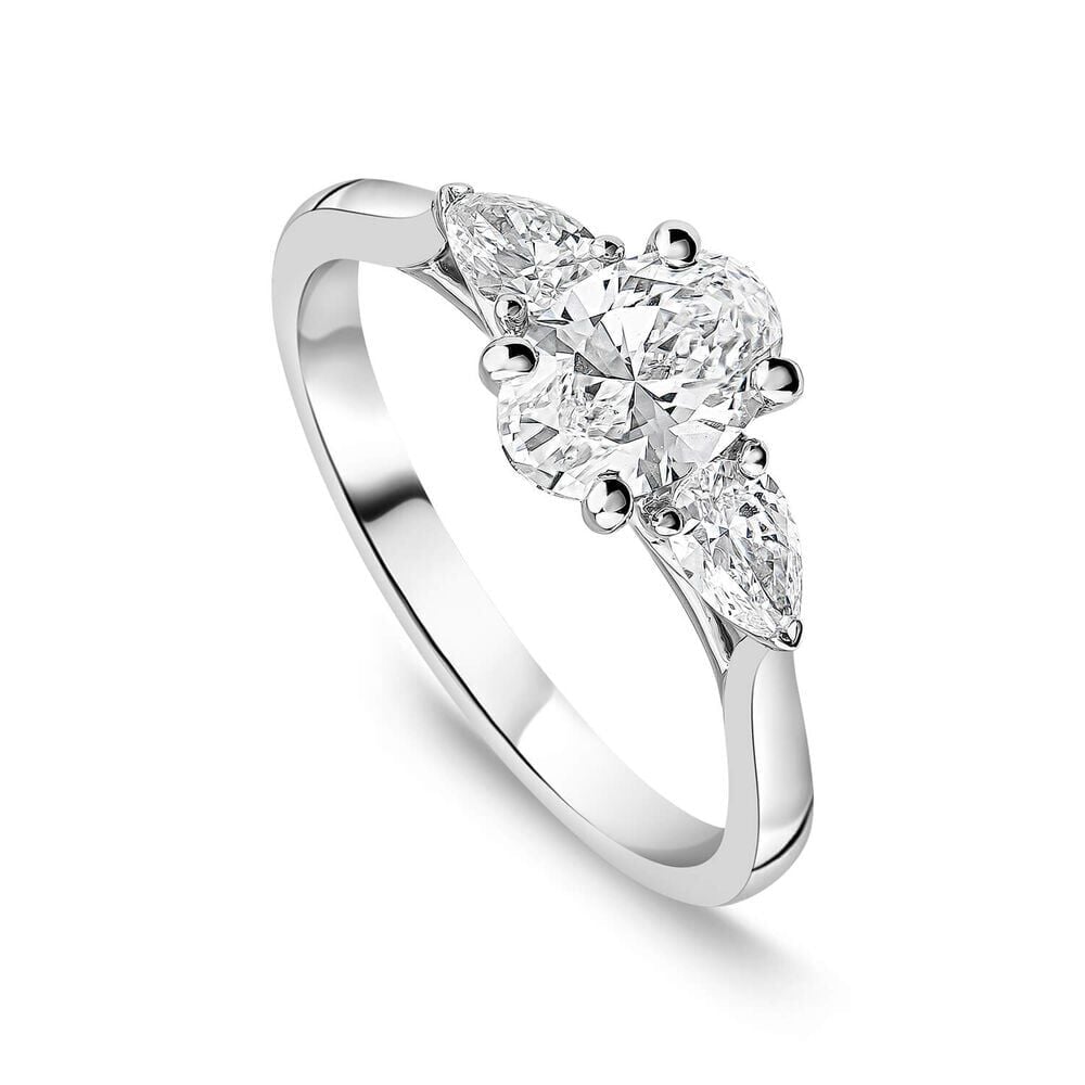 Platinum three-stone engagement ring with 1.40ct lab-grown oval centre diamond flanked by pear-cut side stones.